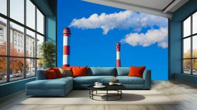 two chimneys with clouds of smoke. Wall mural