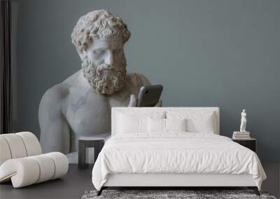 An antique ancient Greek statue using a smartphone, casual attire. Carved from white marble. isolated on background Wall mural