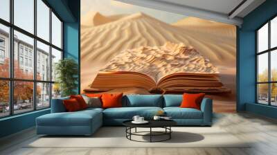 Pages of an open book with a desert scene, complete with sand dunes spilling Wall mural