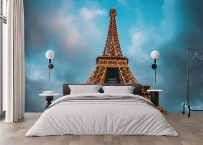 The eiffel tower standing tall against a cloudy parisian sky Wall mural