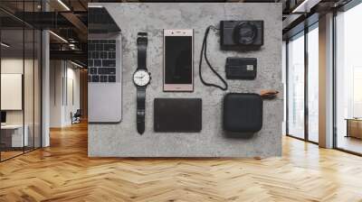 Work on vacation concept, copy space. Flat lay top view of work concept with computer laptop and travel accessories on grey concrete wall Wall mural