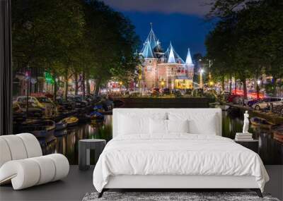 Amsterdam at night, with flowers and bicycles on the bridge, Holland, Netherlands. Wall mural