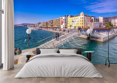 Building of the university at the seafront of Volos city with a copy of Jason’s ancient trireme. Wall mural