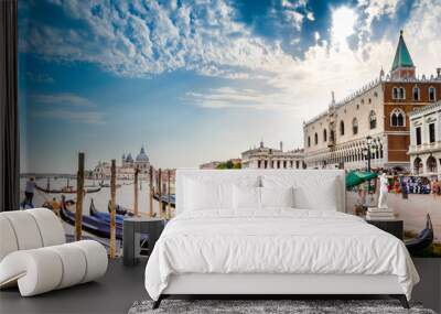 gondolas on canal grande with basilica di santa maria della salute in the background in venice, ital Wall mural