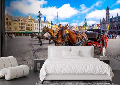 Horse carriages on Grote Markt square in medieval city Brugge at morning, Belgium. Wall mural