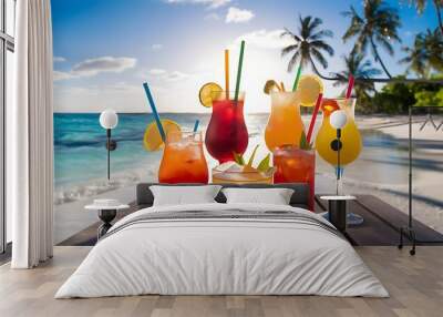 A stunning selective focus image of colorful, exotic cocktails artfully arranged on a white sandy beach Wall mural