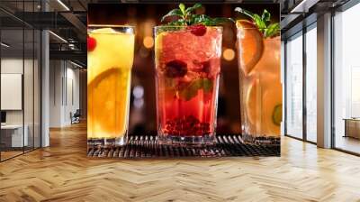 three assorted refreshing fruit cocktails showcased on a bar counter Wall mural