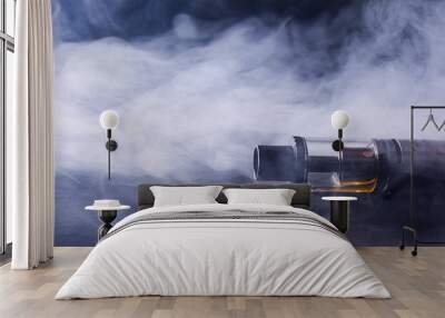 Abstract image of an electronic cigarette in smoke. copy space. The concept of the dangers of smoking, an alternative to cigarettes, bad habits. Wall mural