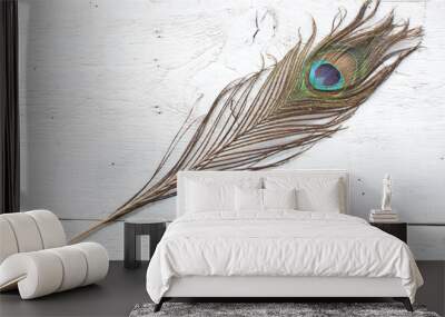 Peacock feather on white wooden background Wall mural