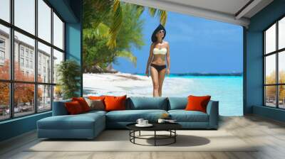 Woman in bikini at tropical beach Wall mural