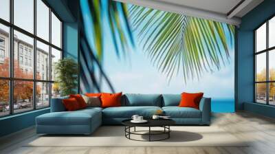 Beautiful defocused beach background framed by palm trees Wall mural