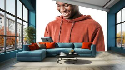 Young black man smiling and looking at his smartphone, transparent background (PNG) Wall mural