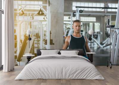 Fitness sport man doing exercises training,Cross fit body and muscular in the gym Wall mural