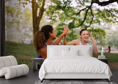 Healthy and lifestyle concept,Young woman raise up hands and relax at public park in the morning together,Happy and smiling,Positive thinking. Wall mural