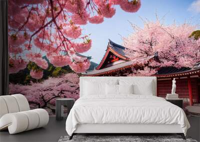 Beautiful japan temple in blossoming sakura garden, pink cherry trees, nature background wallpaper Wall mural