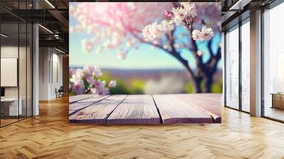 blossoming sakura cherry tree background with empty wooden table for product display, spring nature blurred background, copy space Wall mural