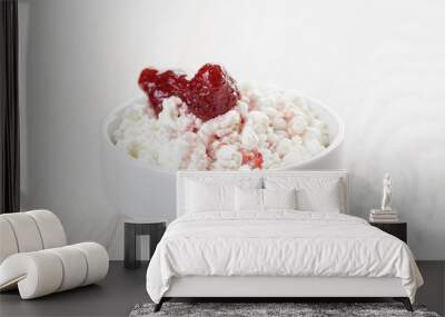 cottage cheese with strawberry jam in white bowl on white wooden Wall mural