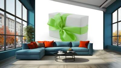 White gift box with green ribbon bow isolated on white background Wall mural