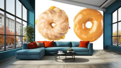 Assorted fresh donuts in a row on a white background Wall mural