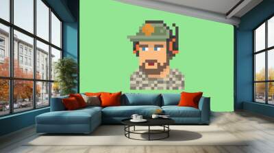 Pixel art vector illustration of a young man with a beard wearing a baseball cap and a black headset, game streamer on green screen background Wall mural