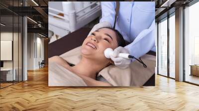 woman receiving ultrasound facial beauty treatment skin care Wall mural