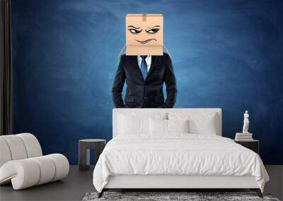 Businessman wearing cardboard box with drawn frowning face on his head Wall mural