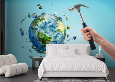 The earth is shattered after being hit by a hammer. Wall mural