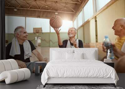 Group of senior men taking a break from playing basketball in an indoor basketball gym Wall mural