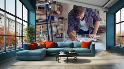 Male artist doing home interior design in the office Wall mural