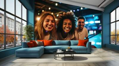 Portrait of a diverse and mixed gorup of young people bowling in a bowling alley Wall mural