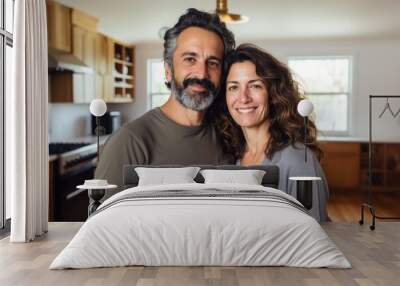 Portrait of a middle aged couple posing in their new apartment after moving in Wall mural