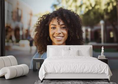 Smiling portrait of a happy female african american student on a college campus Wall mural