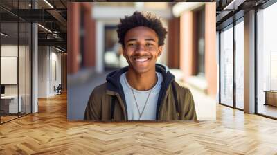 Smiling portrait of a young happy african american male student on a college campus Wall mural