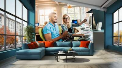 Young and diverse group of people working together in a startup company office Wall mural