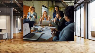 Young business partners having meeting in office Wall mural