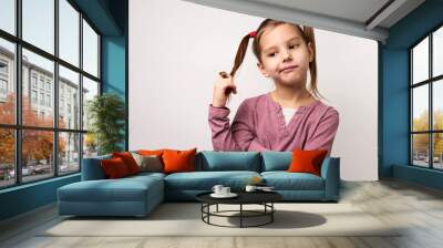 Thinking child girl on white background with copy space Wall mural