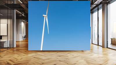 Wind turbines and solar panels in a big green field Wall mural