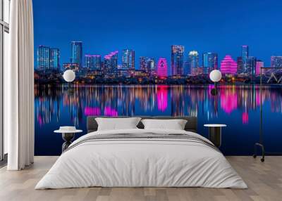 Vibrant city skyline reflecting in water at night with colorful lights Wall mural