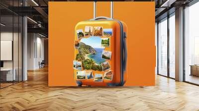 Vibrant suitcase with travel photos against an orange background Wall mural