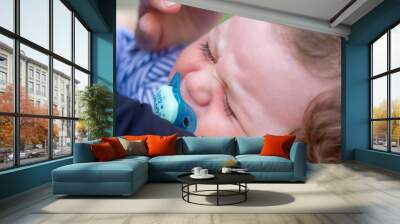 crying boy with his mother, crying baby boy Wall mural