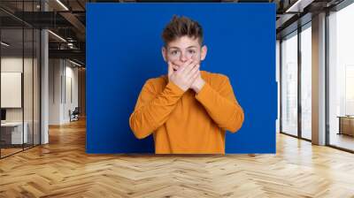 Attractive young guy with a yellow T-shirt Wall mural