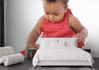 Baby with red phone a over white background Wall mural