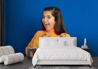 Preteen girl with yellow jersey Wall mural