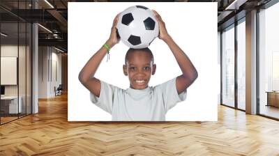 young cute boy holding a soccer ball over his head Wall mural