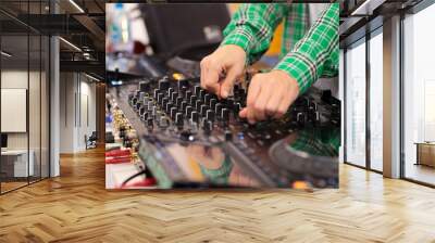 close-up of a DJ mixing music on a mixing console Wall mural