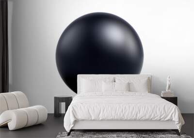 A black ball is sitting on a white background Wall mural