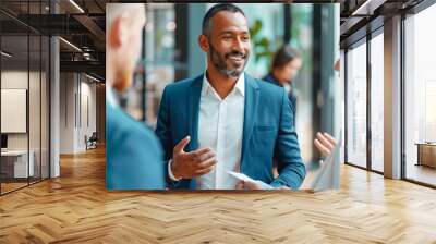 Business Professionals Engaging in a Lively Discussion in a Modern Office Environment Wall mural