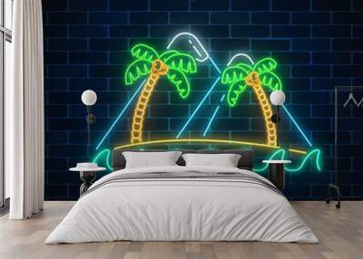 Glowing neon summer sign with two palms, island, mountains and ocean on dark brick wall background. Wall mural