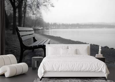 A black and white image of an empty park bench at the waterfront in Silverdale WA : Generative AI Wall mural