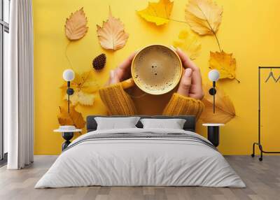 autumn composition with womans hands cup of hot aromatic coffee and autumn yellow leaves flatlay top Wall mural